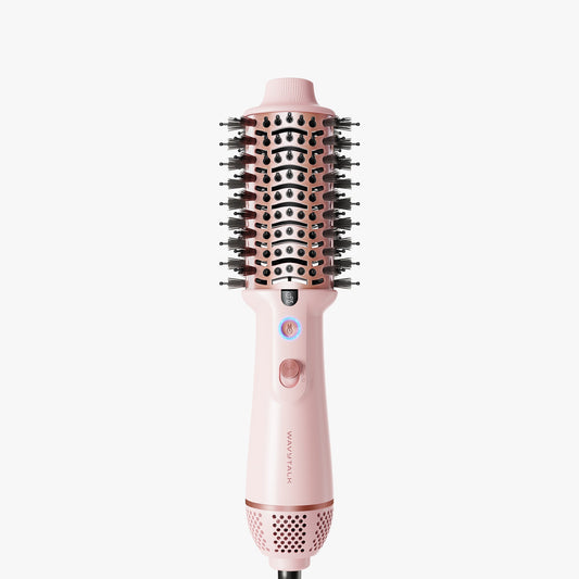 Pink Jet Brush hair styling tool with bristle brush head on a white background