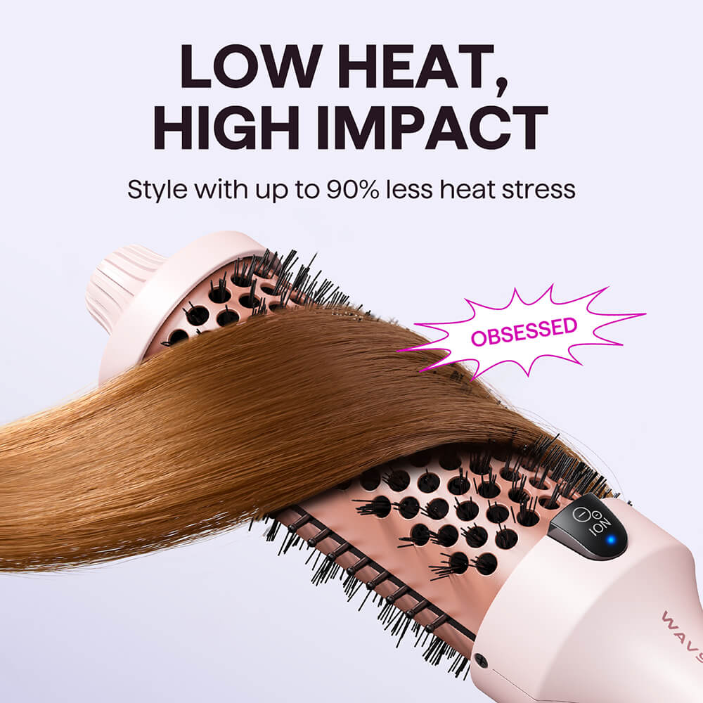 Pink Blowout Boost hair styling tool with text 'Low Heat, High Impact' and 'Obsessed' on a light background