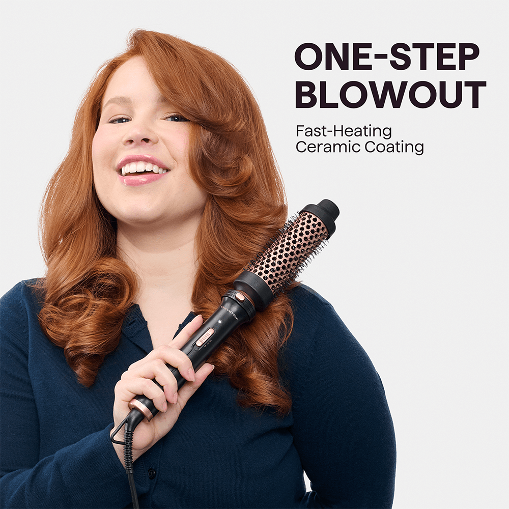 Woman using Pink Multi Curl 5 in 1 with text 'One-Step Blowout' on a light gray background