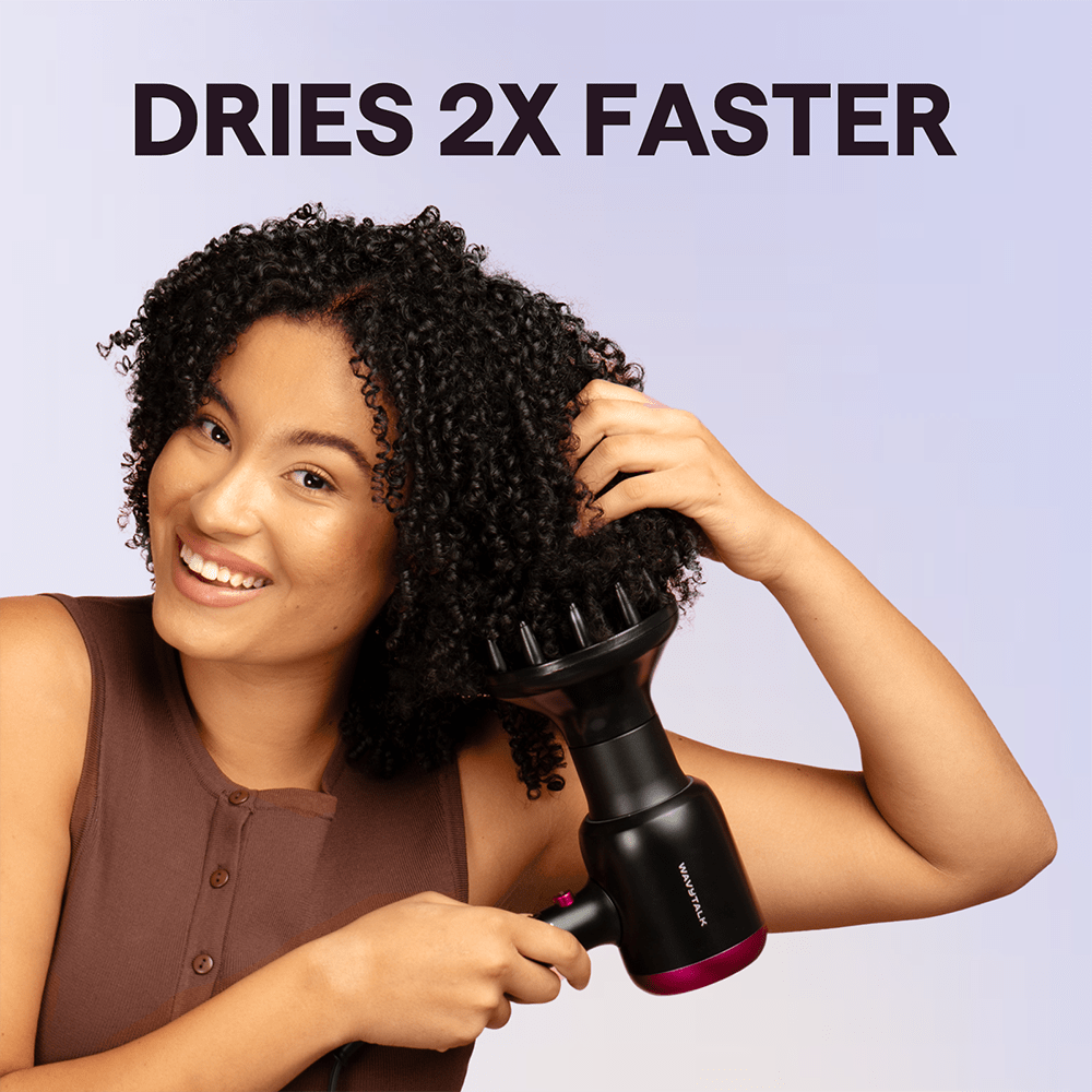 Black Blown Away hair dryer held by a woman, featuring the text "Dries 2X Faster" against a light purple background.