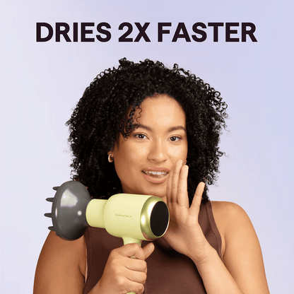 Green Blown Away hair dryer held by a woman, featuring the text "Dries 2X Faster" against a light purple background.
