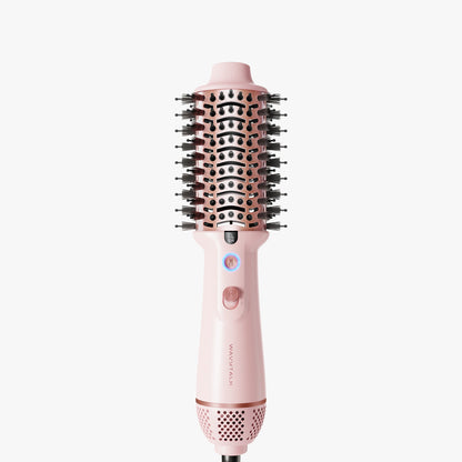 Pink Jet Brush hair styling tool with bristle brush head on a white background