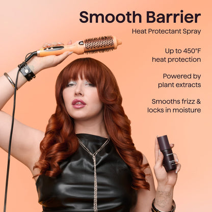 Smooth Barrier Heat Protectant Spray by Wavytalk being used with a thermal round brush on copper red hair for up to 450°F heat protection and frizz control.