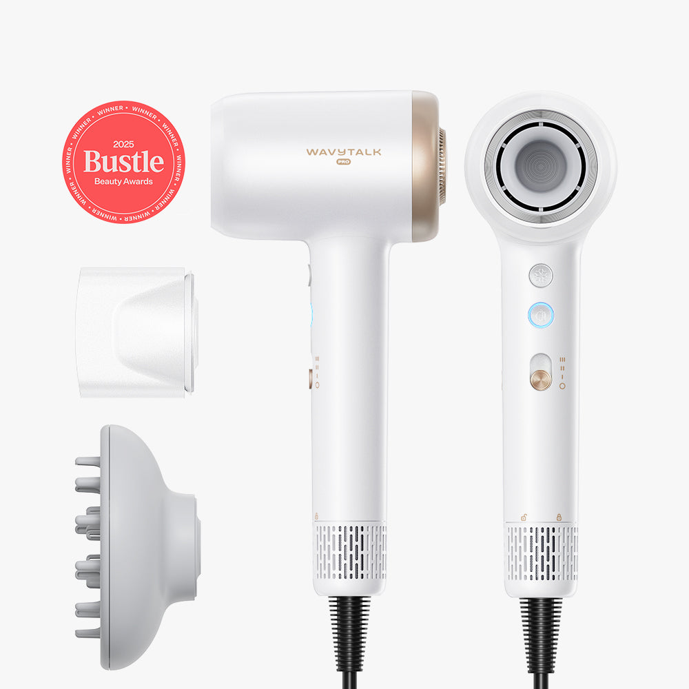 White hair dryer with attachments on a white background, featuring the Bustle Beauty Awards badge.