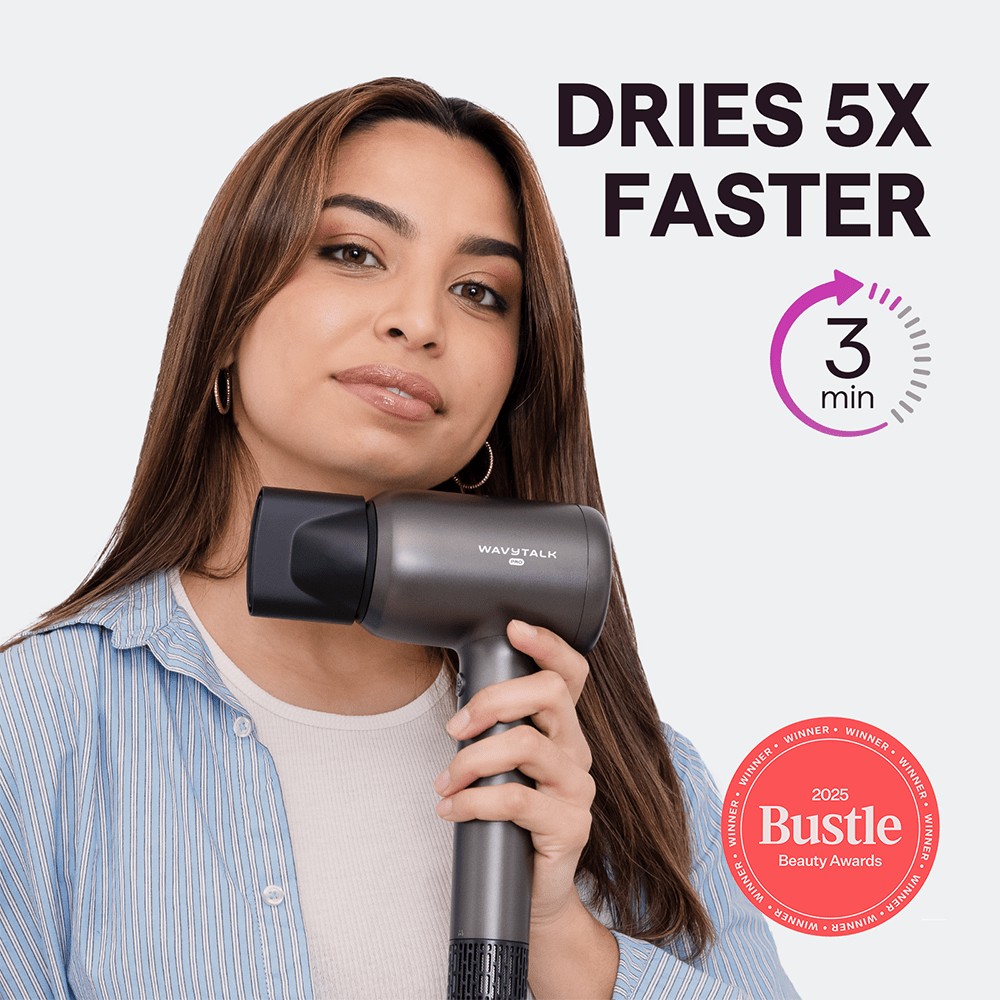 Woman holding a Gray Turblow Pro hair dryer with text indicating it dries hair 5x faster and featuring the Bustle Beauty Awards badge.