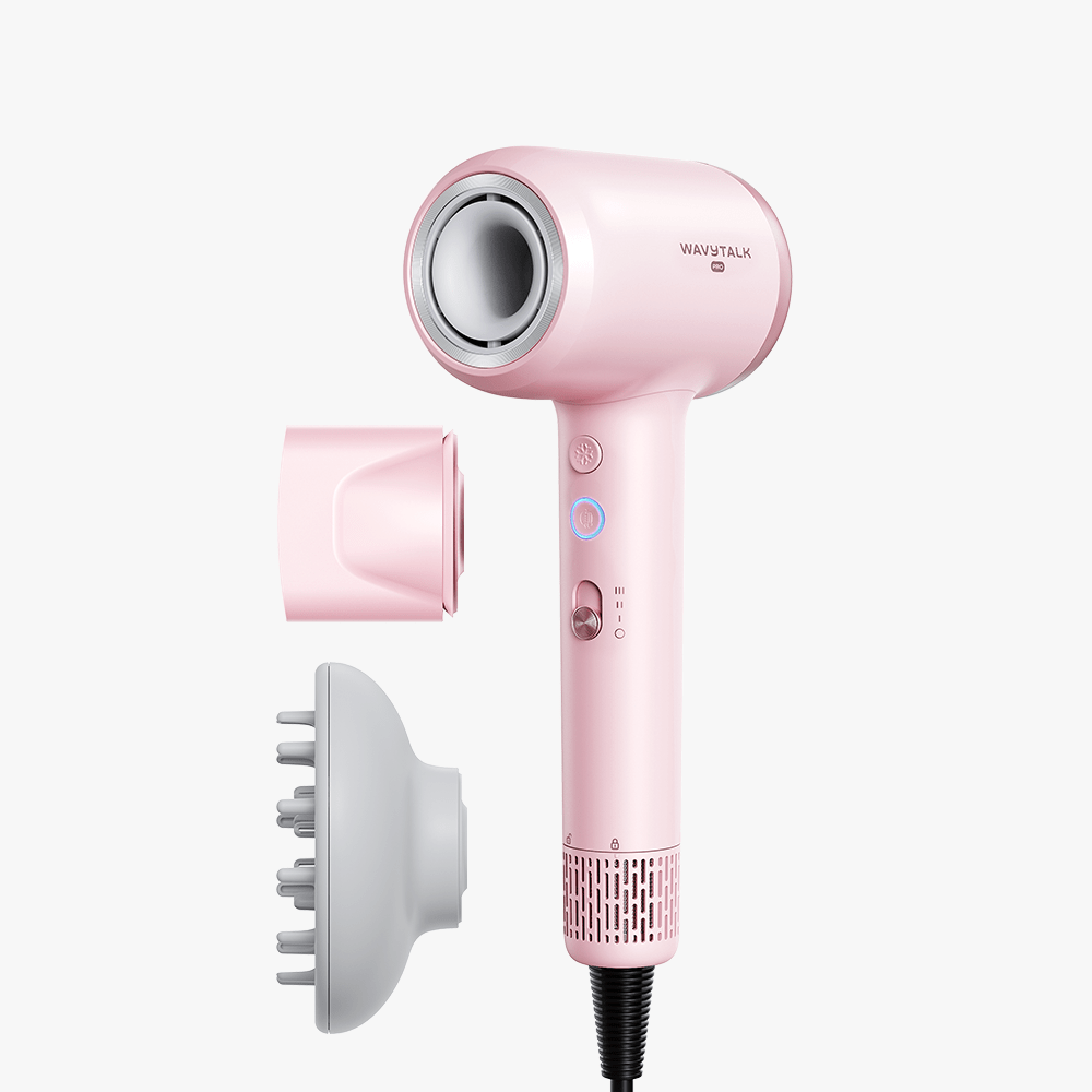 Pink Turblow Pro hair dryer with attachments on a white background