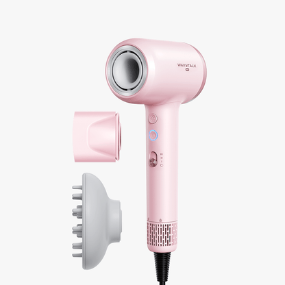 Pink Turblow Pro hair dryer with attachments on a white background