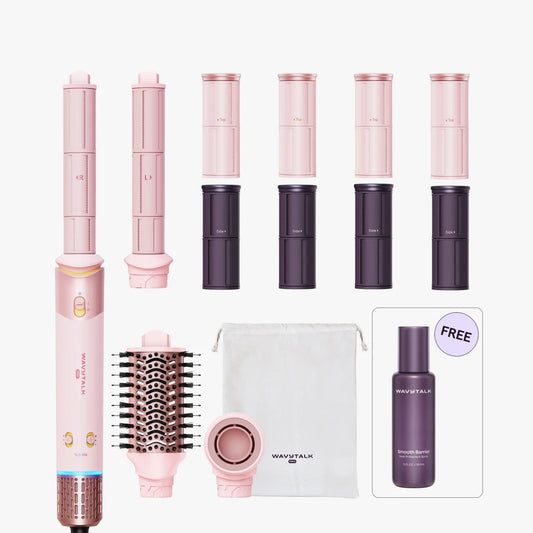 Wavylath hair styling tool set on a white background, featuring a pink and rose gold flat iron, multiple pink and dark purple barrel attachments, a round brush, a white drawstring bag, and a purple bottle with a 'FREE' sticker.