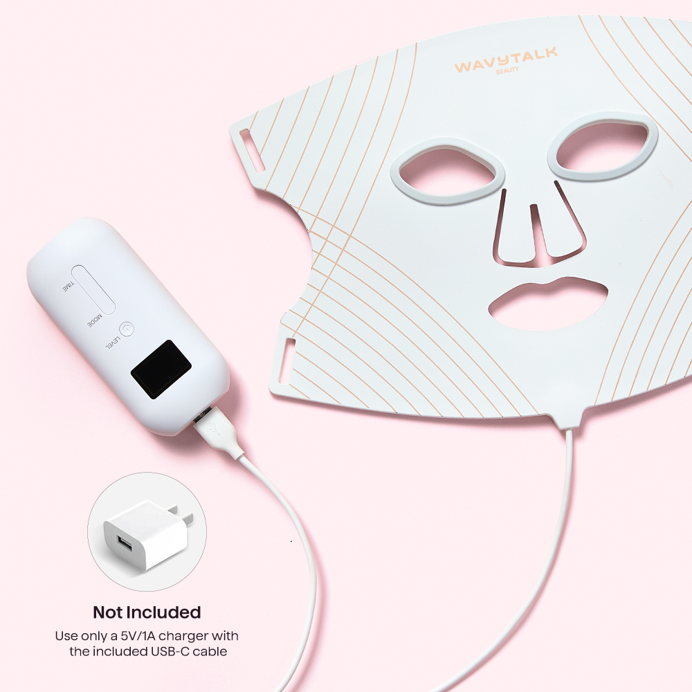 Glow Time LED therapy mask with USB cable and face mask on a pink background