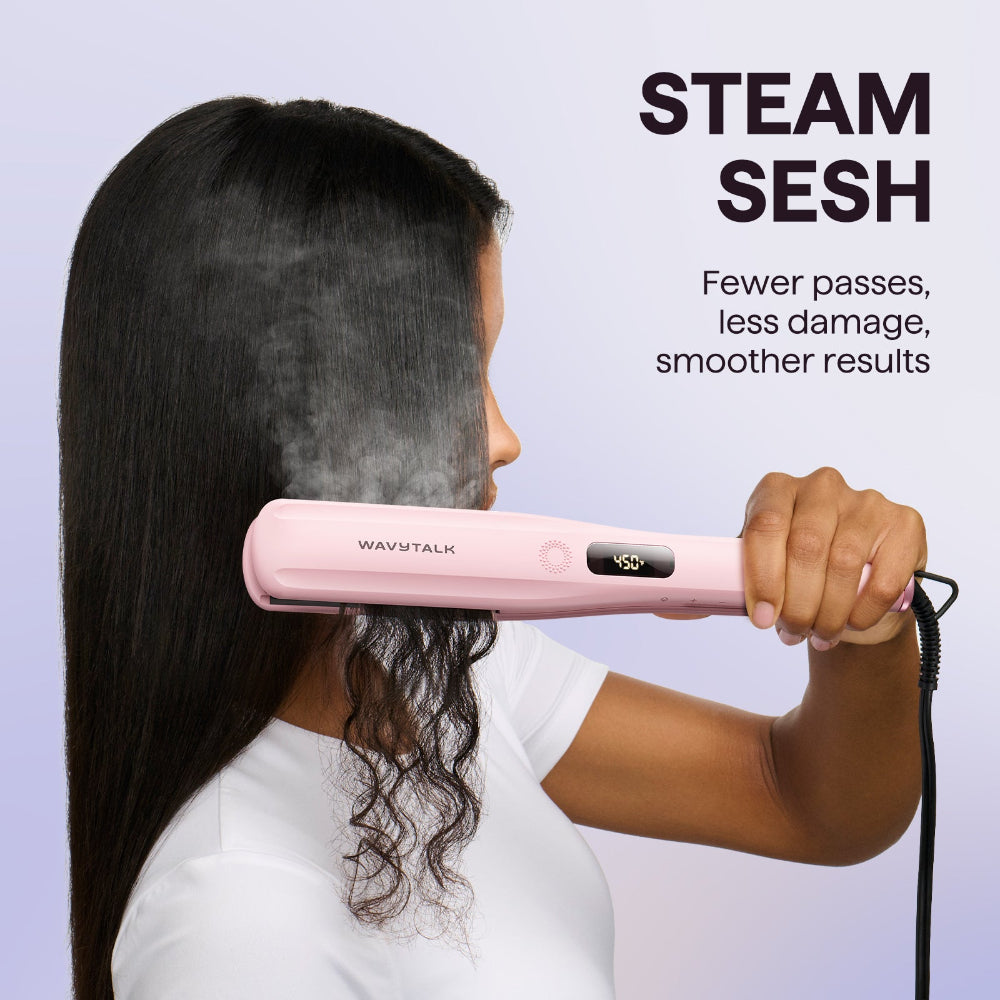 Person using a pink Steam Sesh hair straightener labeled 'Wavytalk' with steam emerging, on a light purple background.
